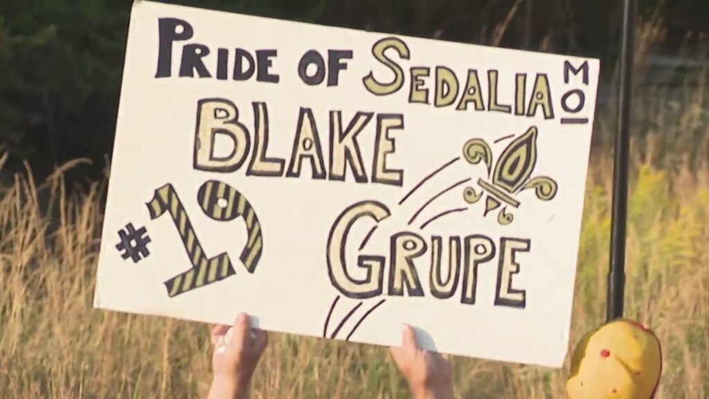 family friends travel from sedalia to cheer on blake grupe
